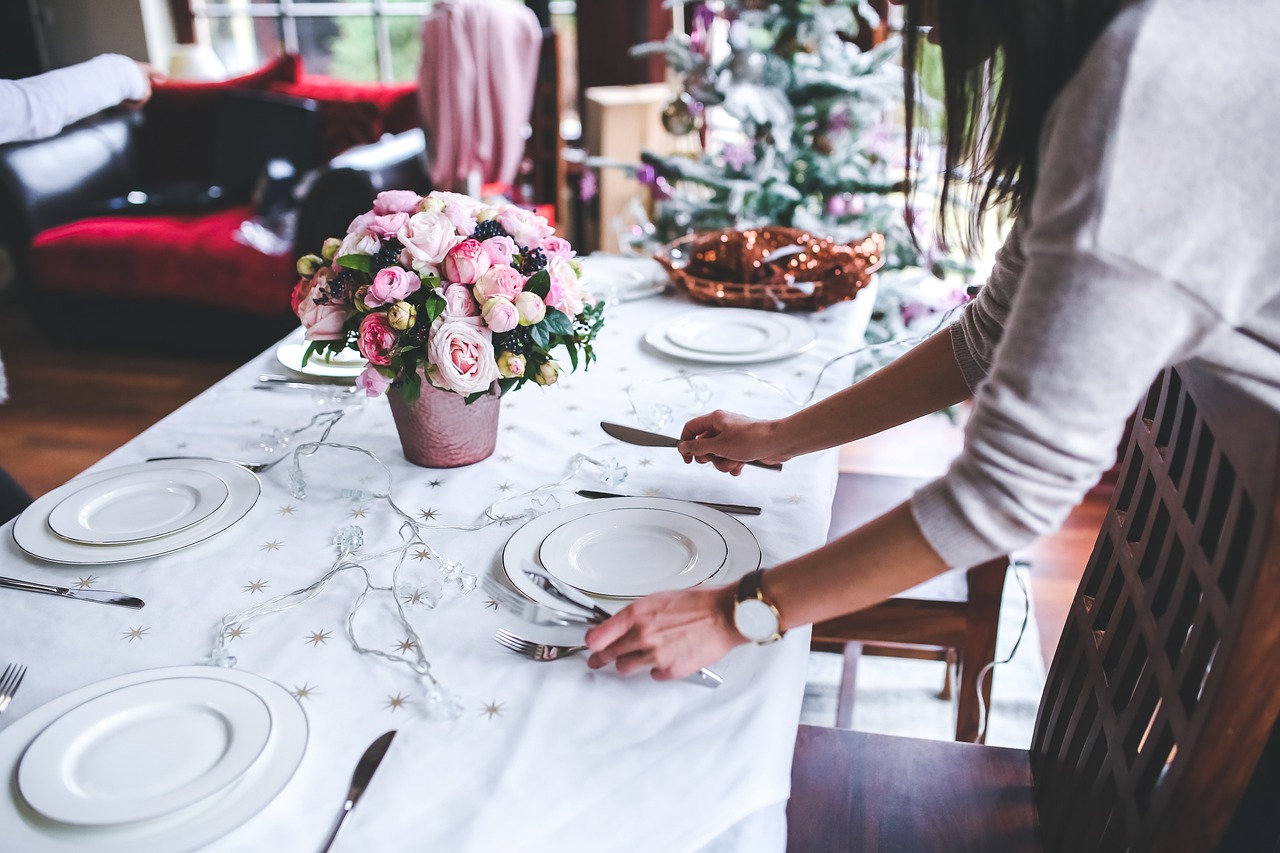 Woman setting up a dinning table